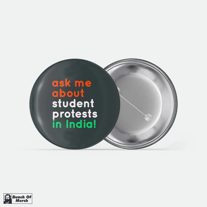 Pin badge reading "ask me about student protests in India!"