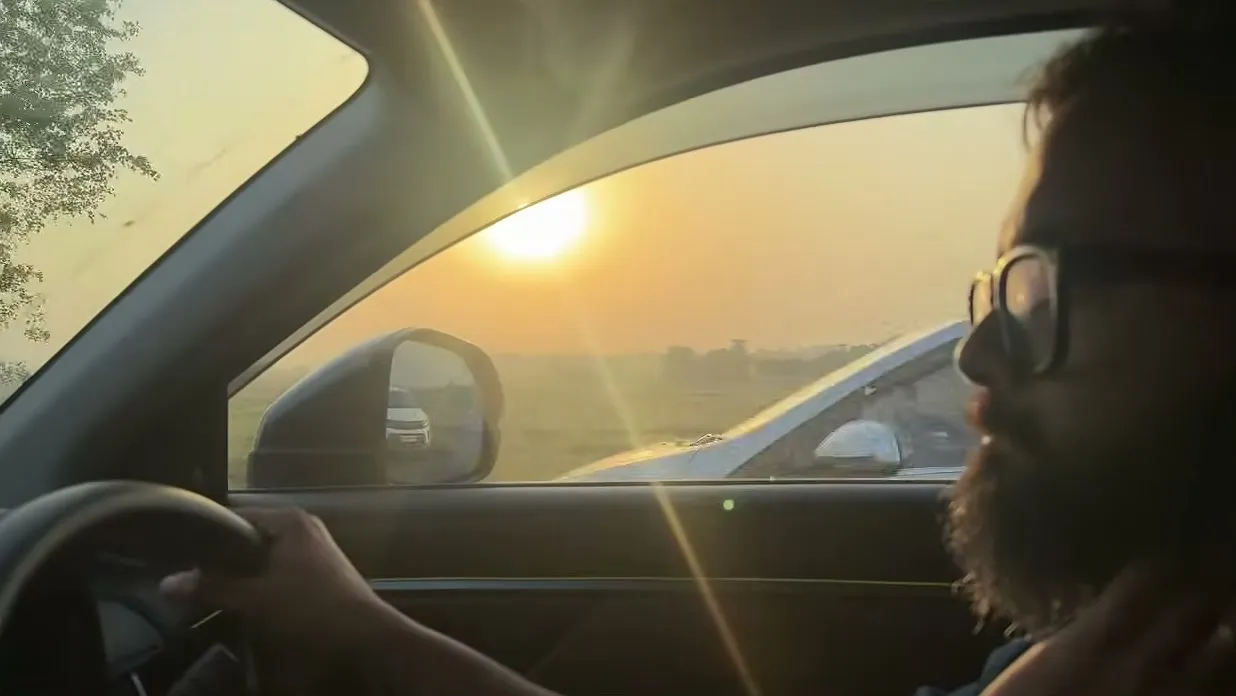 Meghnad at the wheel as the sun sets